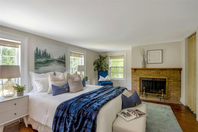 711 Homestead Ave, Maybrook, NY 12543 - bedroom with a fireplace and wood finished floors