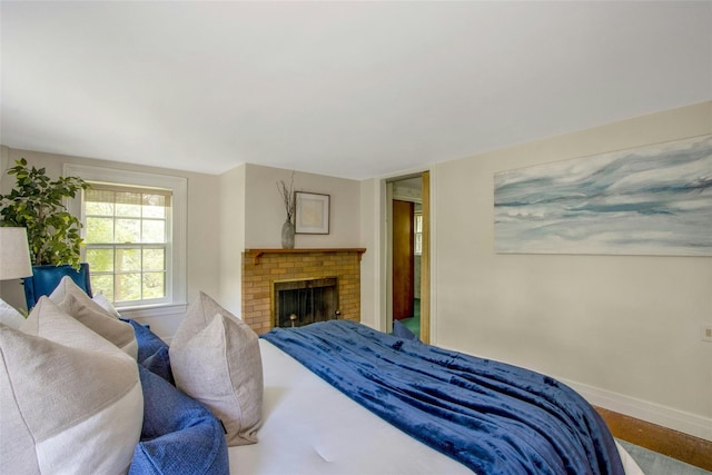 711 Homestead Ave, Maybrook, NY 12543 - bedroom with a fireplace and baseboards