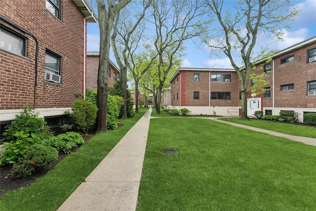 91 Tulip Ave Unit B1, Cartion, Floral Park, NY 11001 - view of community featuring a yard
