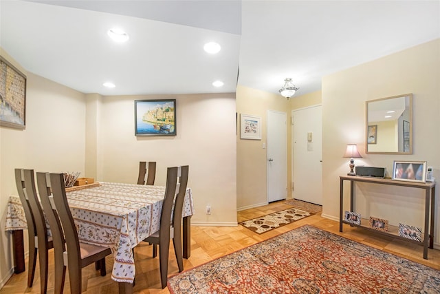 dining room with recessed lighting and baseboards