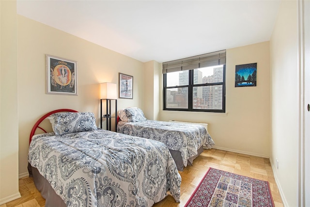 bedroom featuring baseboards