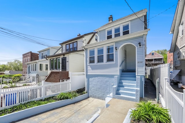 3399 Ely Ave, Bronx, NY 10469 - view of front of house featuring a chimney, fence private yard, and entry steps