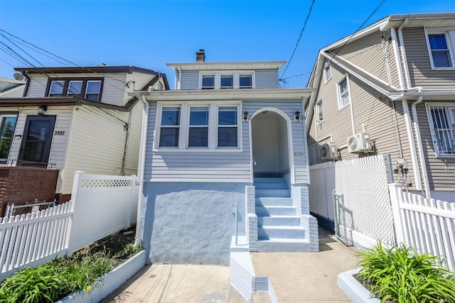 3399 Ely Ave, Bronx, NY 10469 - view of front of house with ac unit, fence, and a chimney