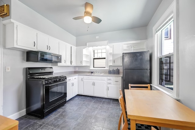 3399 Ely Ave, Bronx, NY 10469 - kitchen featuring a sink, open shelves, black appliances, and white cabinetry