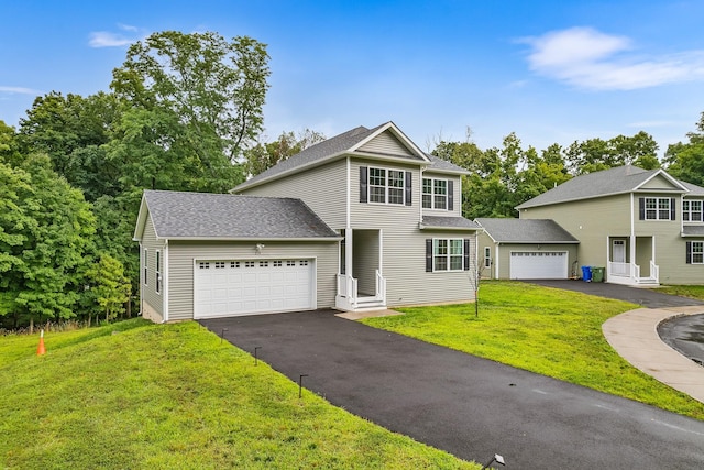 214 Phillips St, Middletown, NY 10940 - view of front of home featuring an attached garage, roof with shingles, driveway, and a front yard