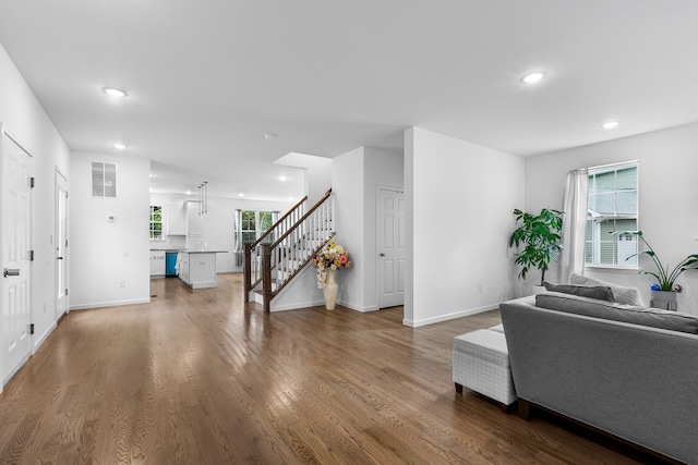 214 Phillips St, Middletown, NY 10940 - living room featuring plenty of natural light, visible vents, wood finished floors, stairway, and recessed lighting