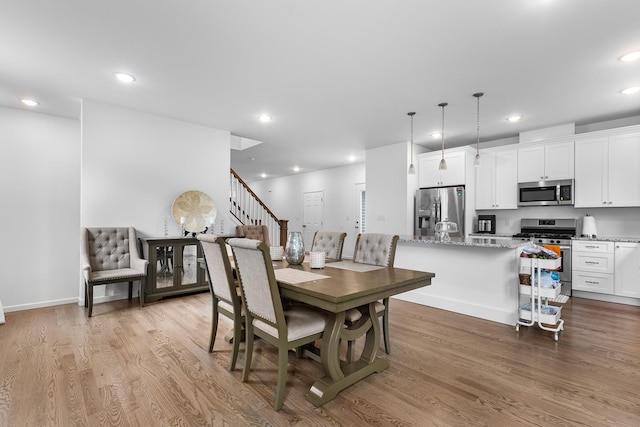 214 Phillips St, Middletown, NY 10940 - dining room with recessed lighting, wood finished floors, and stairs