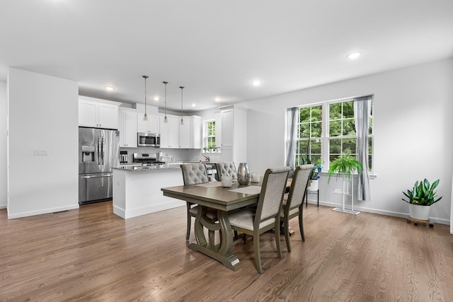 214 Phillips St, Middletown, NY 10940 - dining area featuring recessed lighting, baseboards, and wood finished floors