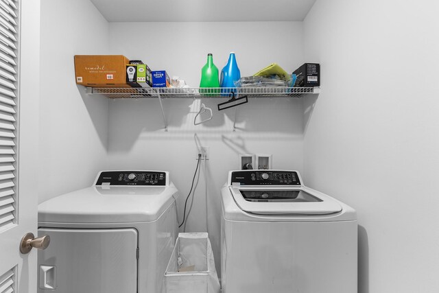 214 Phillips St, Middletown, NY 10940 - clothes washing area featuring washing machine and clothes dryer and laundry area