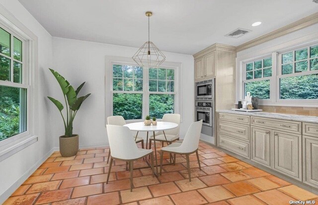 1 Breeze Hill Rd, Northport, NY 11768 - dining area with visible vents, baseboards, and plenty of natural light