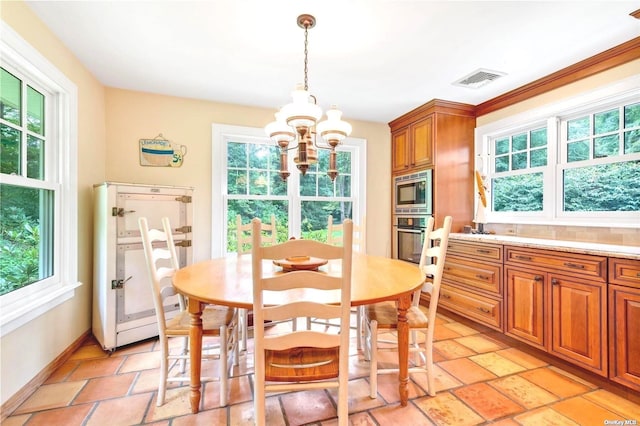 1 Breeze Hill Rd, Northport, NY 11768 - dining space with plenty of natural light, a notable chandelier, and visible vents