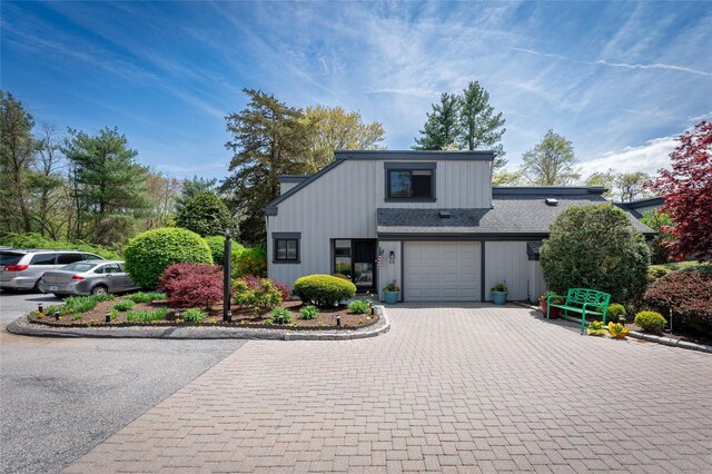 view of front of house with board and batten siding and driveway