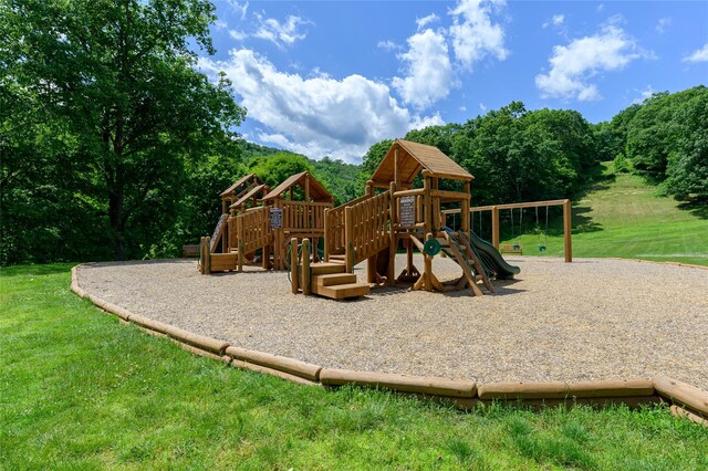 community play area with a lawn