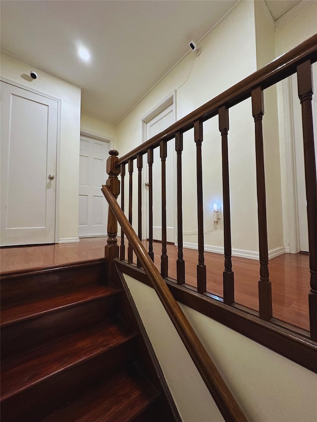 stairs with wood finished floors