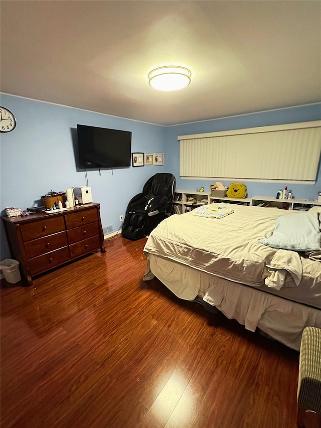bedroom with wood finished floors