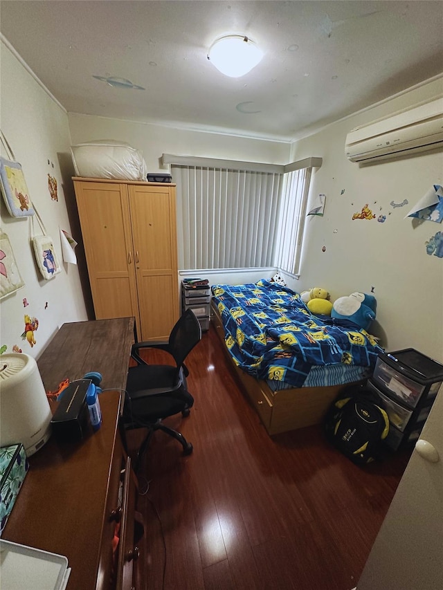 bedroom with wood-type flooring and an AC wall unit