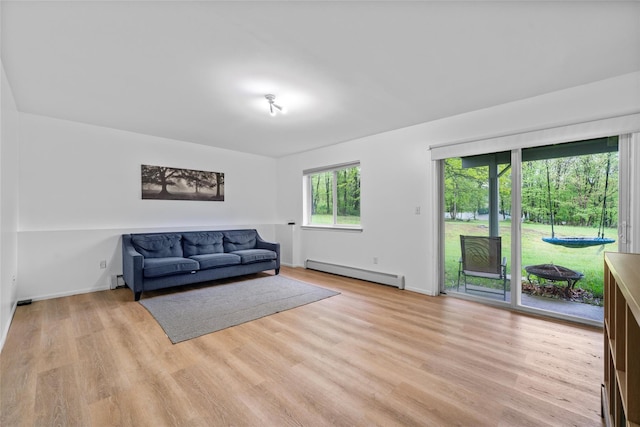 4 Sequoia Trl, Highland Mills, NY 10930 - living area with light wood-style flooring, baseboards, and a baseboard heating unit