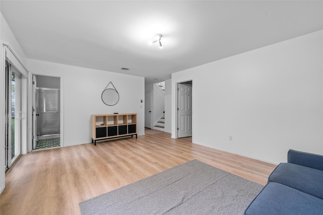 4 Sequoia Trl, Highland Mills, NY 10930 - living area with light wood-style floors, stairway, baseboards, and visible vents