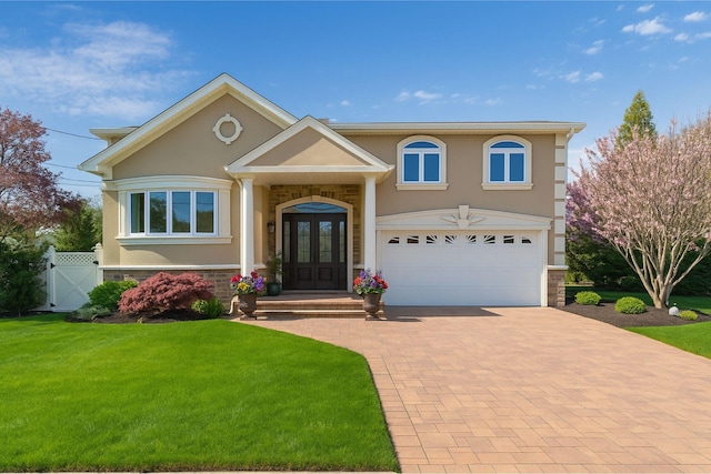 2035 Sans Ave, Merrick, NY 11566 - view of front of house with decorative driveway, stucco siding, french doors, and stone siding
