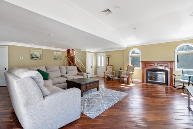 2035 Sans Ave, Merrick, NY 11566 - living area with visible vents, ornamental molding, dark wood-style flooring, a glass covered fireplace, and stairway