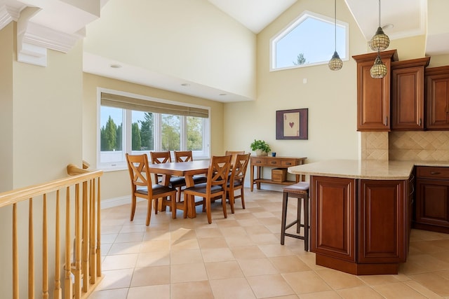 2035 Sans Ave, Merrick, NY 11566 - dining room with light tile patterned flooring, high vaulted ceiling, and a healthy amount of sunlight