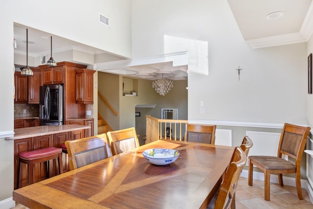2035 Sans Ave, Merrick, NY 11566 - dining area with crown molding, a notable chandelier, stairs, light tile patterned floors, and visible vents