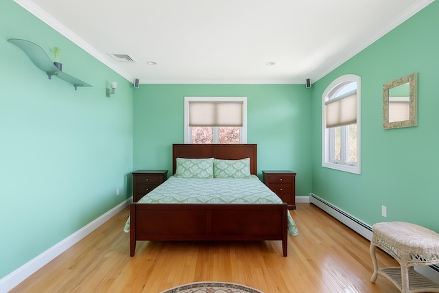 2035 Sans Ave, Merrick, NY 11566 - bedroom with crown molding, visible vents, baseboards, light wood-type flooring, and a baseboard heating unit