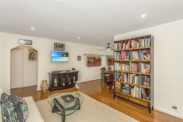 36-07 171st St Unit 36, Flushing, NY 11358 - living room featuring recessed lighting, arched walkways, and wood finished floors