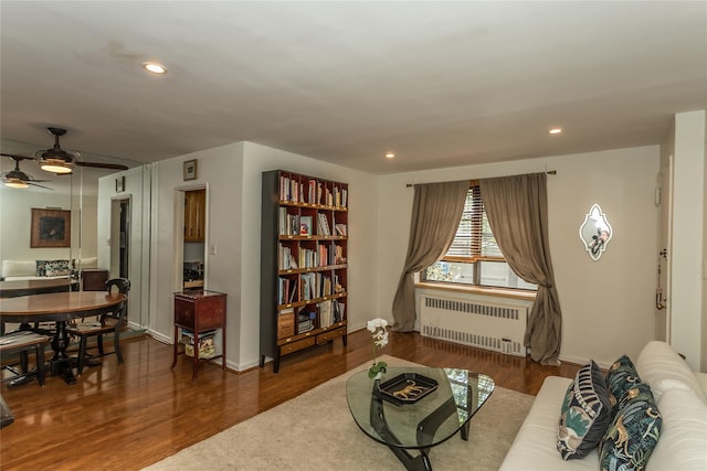 36-07 171st St Unit 36, Flushing, NY 11358 - living room featuring a ceiling fan, wood finished floors, baseboards, radiator heating unit, and recessed lighting