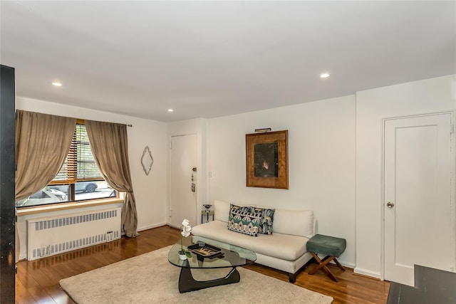36-07 171st St Unit 36, Flushing, NY 11358 - living room with recessed lighting, radiator heating unit, and wood finished floors