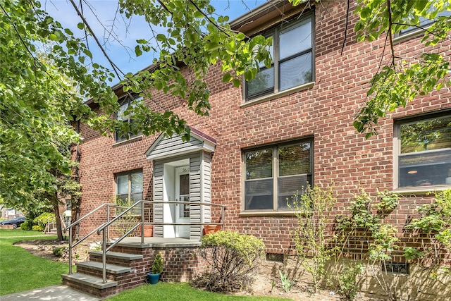 36-07 171st St Unit 36, Flushing, NY 11358 - view of front of property with a front yard and brick siding