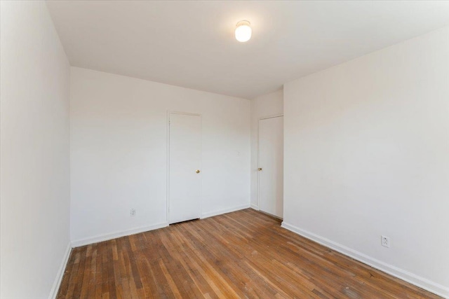 142-20 26th Ave Unit 5H, Flushing, NY 11354 - spare room with hardwood / wood-style flooring and baseboards