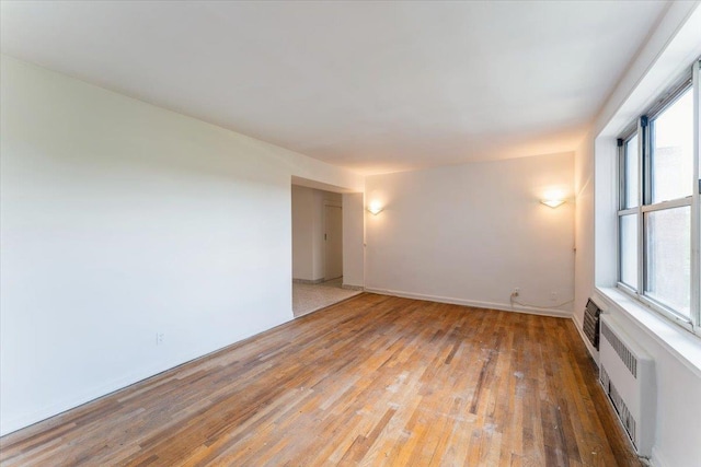 142-20 26th Ave Unit 5H, Flushing, NY 11354 - unfurnished room with light wood-style flooring and baseboards