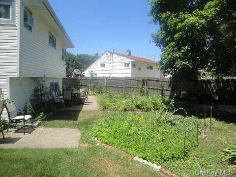 view of yard with a patio and a fenced backyard