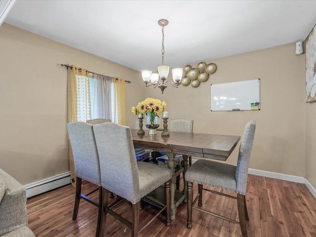 dining area with baseboards, a baseboard radiator, an inviting chandelier, and wood finished floors