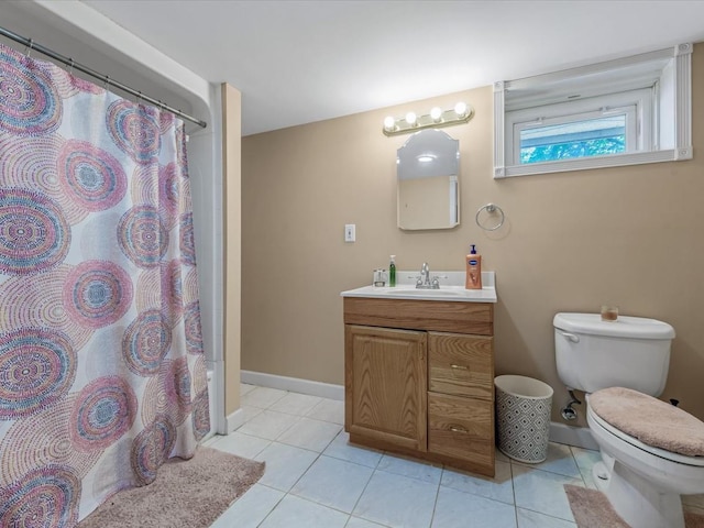 bathroom featuring toilet, a shower with shower curtain, baseboards, tile patterned flooring, and vanity