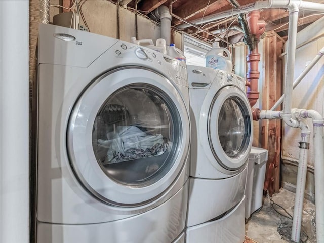 laundry area with laundry area and washer and clothes dryer