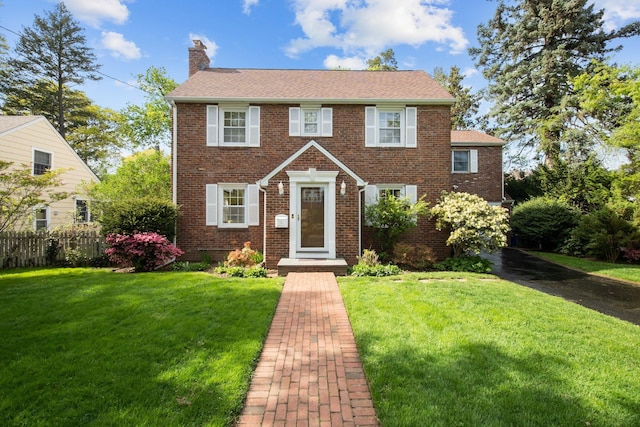 19 Donald St, East Williston, NY 11596 - view of front of home with a chimney and brick siding