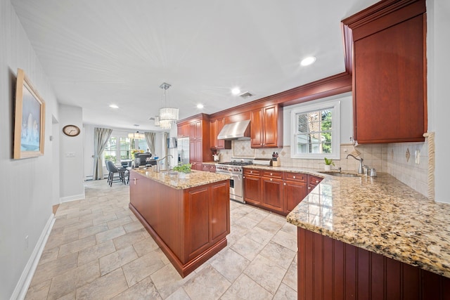 19 Donald St, East Williston, NY 11596 - kitchen with a sink, wall chimney exhaust hood, stainless steel appliances, baseboards, and backsplash