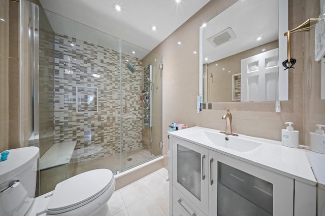 19 Donald St, East Williston, NY 11596 - bathroom with toilet, a shower stall, tile patterned flooring, vanity, and recessed lighting