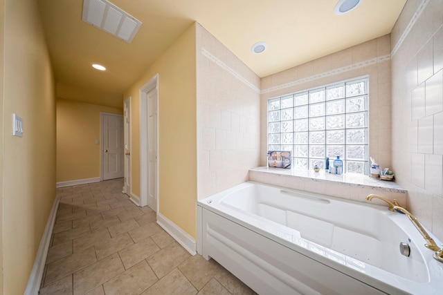 19 Donald St, East Williston, NY 11596 - bathroom with a bath, tile patterned floors, recessed lighting, and baseboards