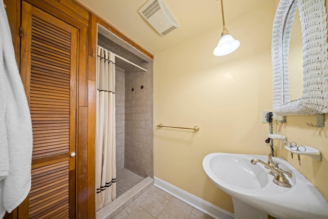 19 Donald St, East Williston, NY 11596 - full bath featuring tiled shower, baseboards, tile patterned floors, and a sink