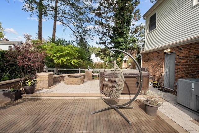 19 Donald St, East Williston, NY 11596 - deck featuring a hot tub, an outdoor fire pit, a patio area, and cooling unit