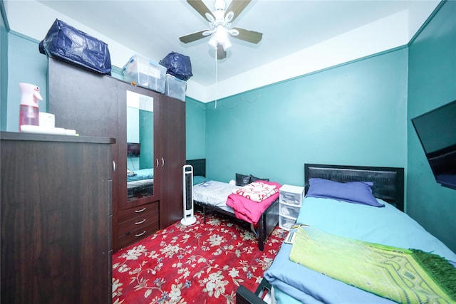 carpeted bedroom with a ceiling fan