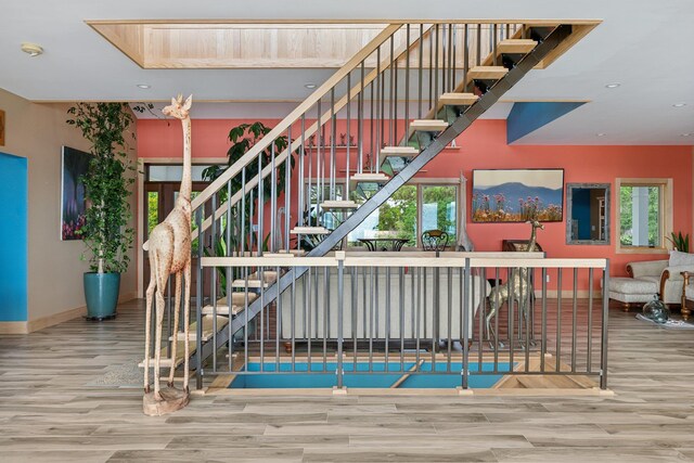 516 Asharoken Ave, Northport, NY 11768 - staircase featuring wood finished floors, baseboards, and recessed lighting