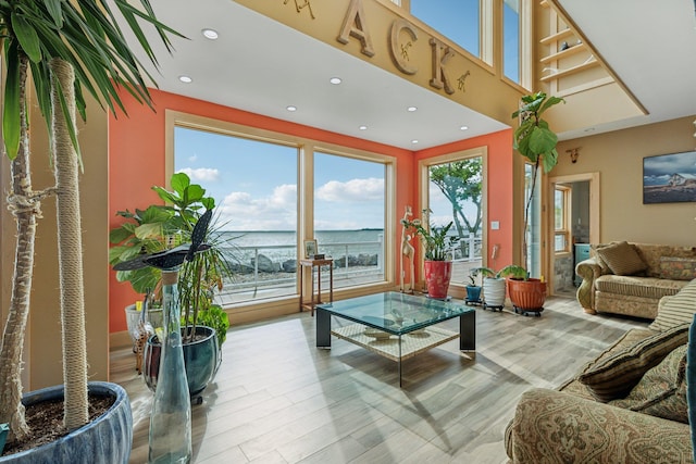 516 Asharoken Ave, Northport, NY 11768 - living room featuring recessed lighting, wood finished floors, and a water view