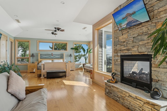 516 Asharoken Ave, Northport, NY 11768 - bedroom featuring wood-type flooring, baseboards, and a stone fireplace