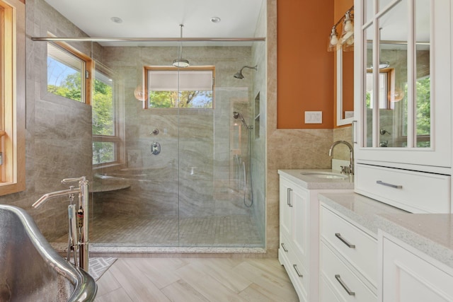 516 Asharoken Ave, Northport, NY 11768 - full bathroom featuring tile walls, a shower stall, and vanity