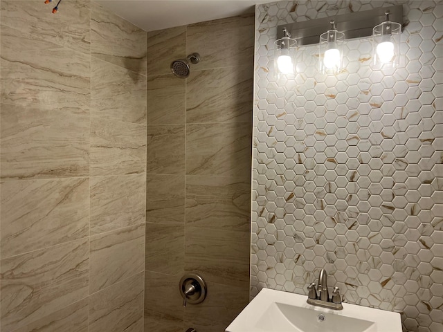 776 Brook Ave Unit 33C, Bronx, NY 10451 - bathroom with a tile shower, a sink, and tile walls