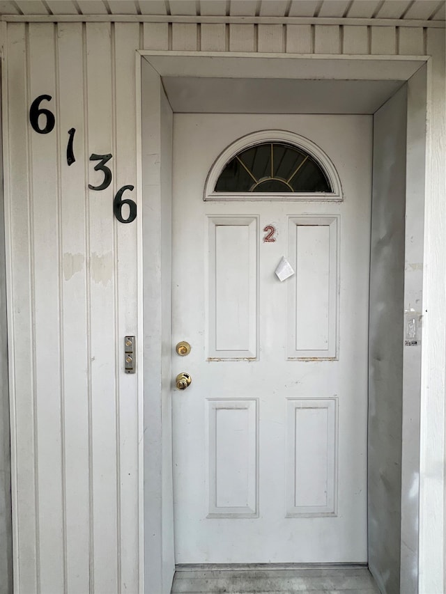 entrance to property featuring board and batten siding